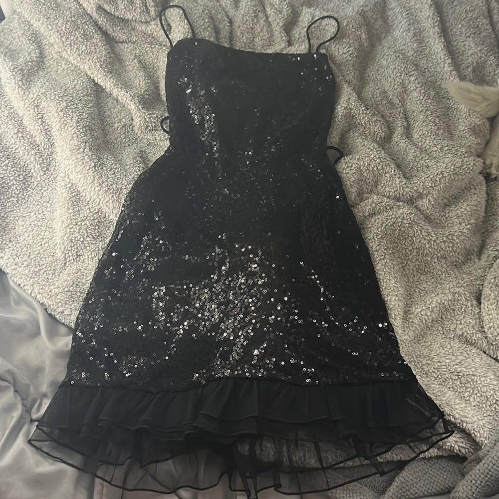 Lucy in the Sky: black sequin formal dress- open back, ruffled bottom.